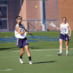 lacrosse player throwing ball