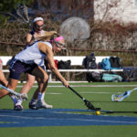 lacrosse player picking ball